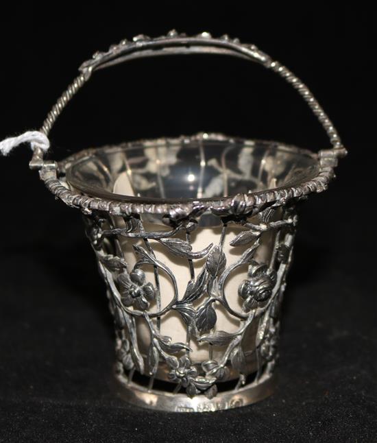 A George III silver cream pail, pierced with floral design, London 1768, William Vincent (base a.f), with clear glass liner